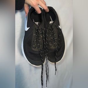 Black Nike running shoes.